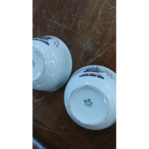 231 - Pair of white porcelain bowls printed with clipper ship illustration and red legend “It was built in... 