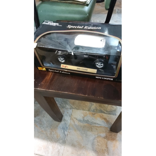 241 - Maisto Special Edition 1:18 scale die-cast model Mini Cooper, factory sealed in display box.
