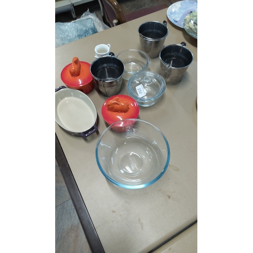 250 - Group comprising three stainless steel pails, two orange enameled stoneware mini cocottes with anima... 