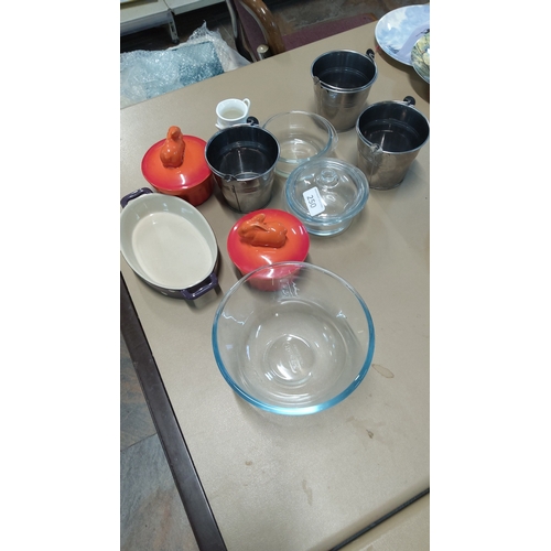 250 - Group comprising three stainless steel pails, two orange enameled stoneware mini cocottes with anima... 