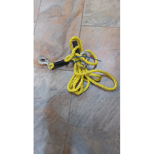 267 - Yellow braided synthetic tow rope with steel claw hooks at each end.