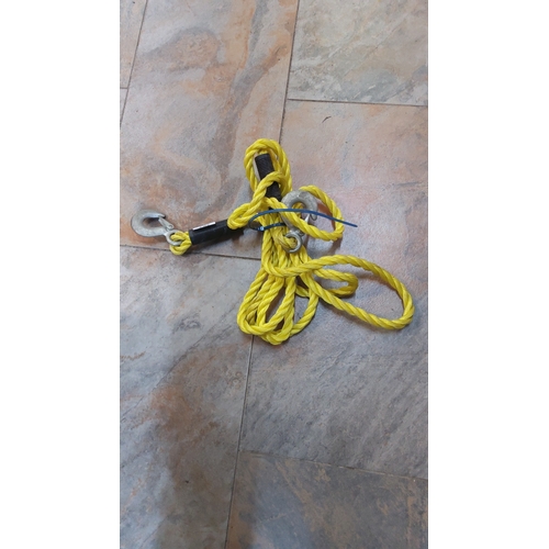 267 - Yellow braided synthetic tow rope with steel claw hooks at each end.
