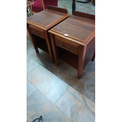 282 - Pair of rectangular wooden bedside cabinets, each with galleried back, single brass-handled drawer a... 