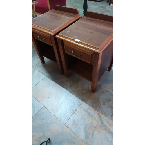 282 - Pair of rectangular wooden bedside cabinets, each with galleried back, single brass-handled drawer a... 