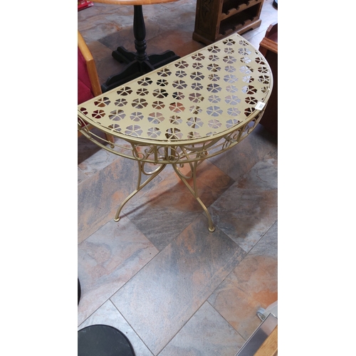 283 - Demi-lune pierced metal console table with clover cutwork top, scrollwork apron and three splayed le... 