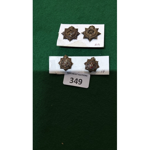 349 - Group of four British Royal Army Service Corps star-form collar badges, two bronzed OSD examples and... 