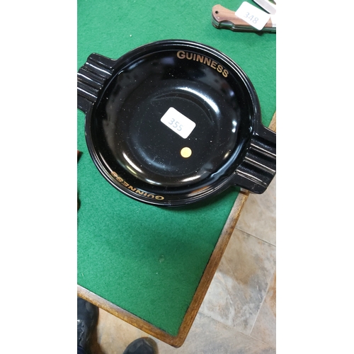355 - Black glass pub ashtray with triple rests, gilt “GUINNESS” script; base moulded “Arthur Guinness & S... 