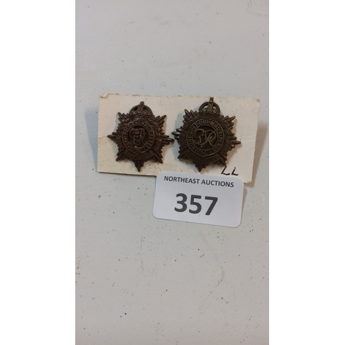 357 - Pair of bronzed metal eight-point garter star collar badges, each bearing George V cypher within “Ho... 