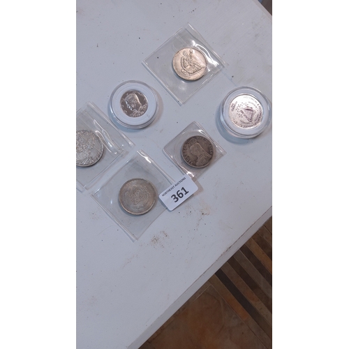 361 - Group of six world silver tone crown-size coins, assorted designs and dates, housed individually in ... 