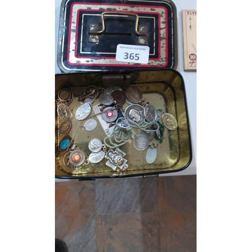 365 - Collection of assorted metal Catholic devotional medals, pendants and religious tokens housed in a v... 