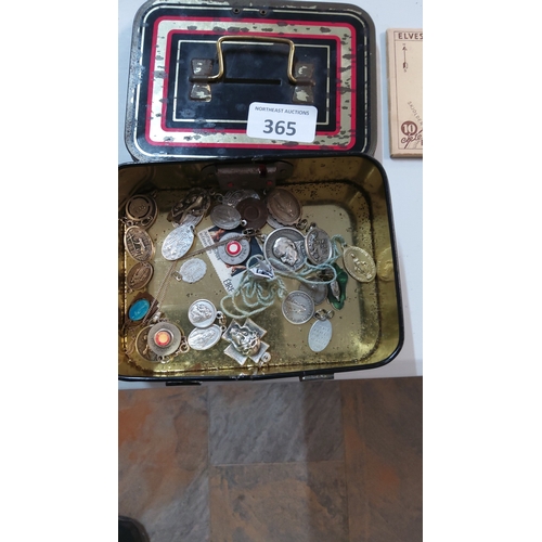 365 - Collection of assorted metal Catholic devotional medals, pendants and religious tokens housed in a v... 