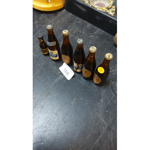 366 - Group of six vintage miniature amber-glass beer bottles, comprising Harp Lager, Guinness and associa... 