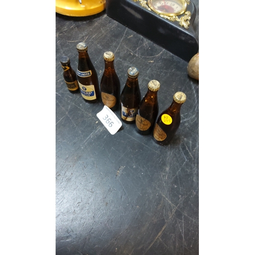 366 - Group of six vintage miniature amber-glass beer bottles, comprising Harp Lager, Guinness and associa... 