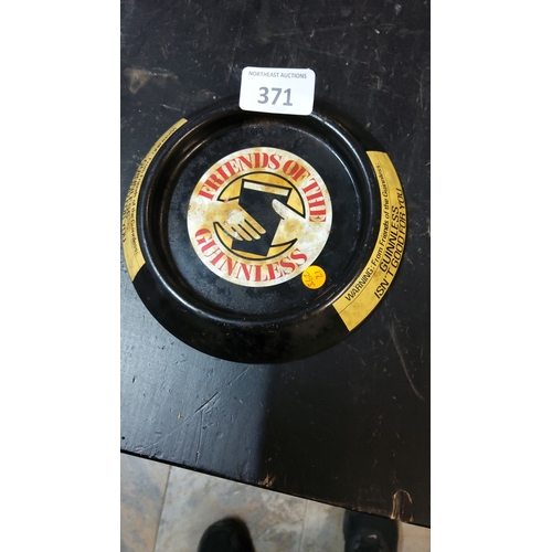371 - Guinnless advertising tin ashtray, circular black-painted metal with ‘Friends of the Guinnless’ hand... 