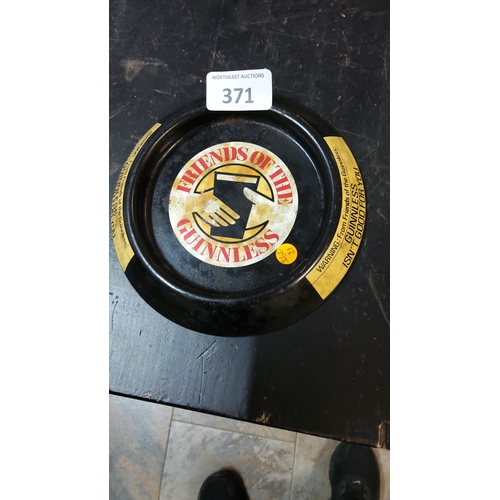 371 - Guinnless advertising tin ashtray, circular black-painted metal with ‘Friends of the Guinnless’ hand... 