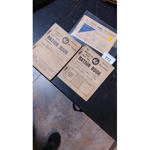 372 - Group of three British Ministry of Food ration and motor-fuel books, 1952–1954, printed paper bookle... 