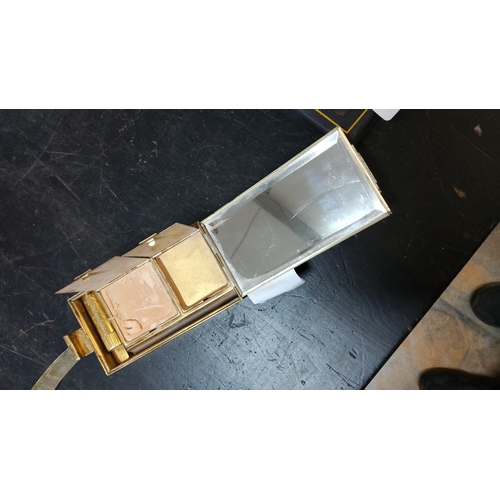 374 - Gold-tone rectangular vanity compact with integral mirror, twin powder compartments, lipstick holder... 