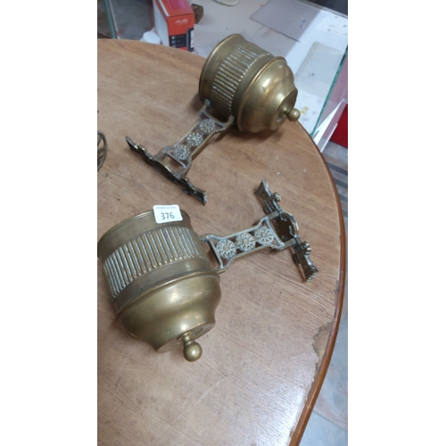 376 - Pair of Victorian cast brass wall-mounted swivel sconces, each with reeded cylindrical nozzle, turne... 