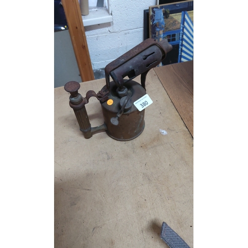 380 - Early 20th-century brass paraffin blowlamp with ribbed grip, integrated pump and adjustable burner h... 