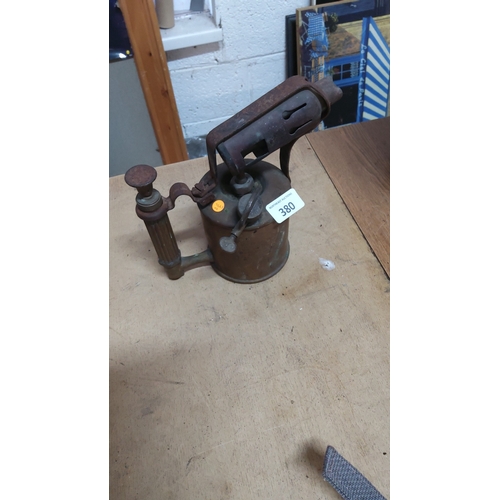380 - Early 20th-century brass paraffin blowlamp with ribbed grip, integrated pump and adjustable burner h... 