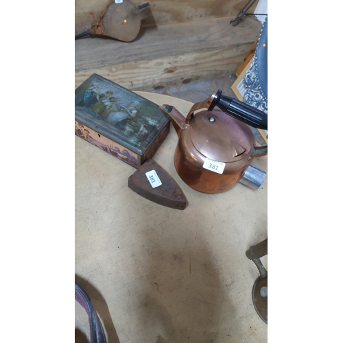 381 - Group of three vintage household items comprising copper kettle with ebonised handle, triangular cas... 
