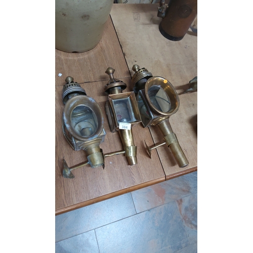 384 - Set of three brass coach lanterns with glass panels and mounting brackets, late 19th/early 20th cent... 