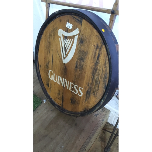 390 - Guinness branded wooden barrel head, circular oak panel with stencilled harp emblem and lettering, b... 