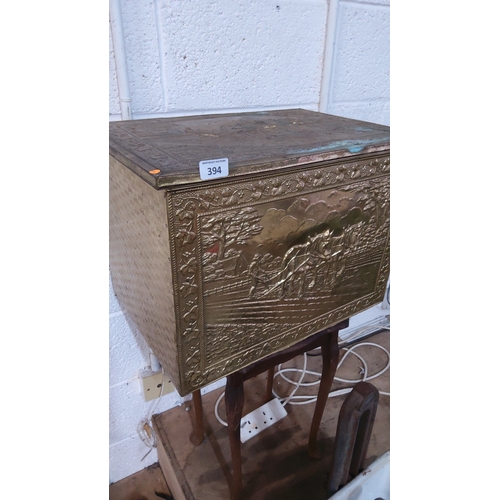 394 - Embossed brass-clad stick box with hinged lid, the front panel relief-decorated with a ploughman and... 
