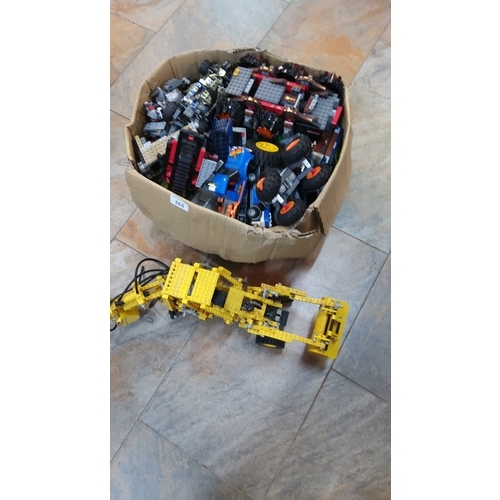 263 - Group of loose LEGO bricks, wheels and part-built models including a yellow Technic articulated fron... 