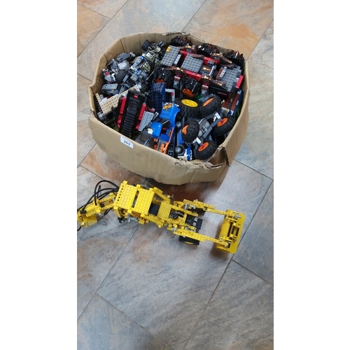 263 - Group of loose LEGO bricks, wheels and part-built models including a yellow Technic articulated fron... 