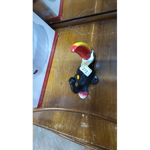 272 - Hand-painted cast iron toucan with red-and-yellow beak, designed as a coat hanger with twin mounting... 