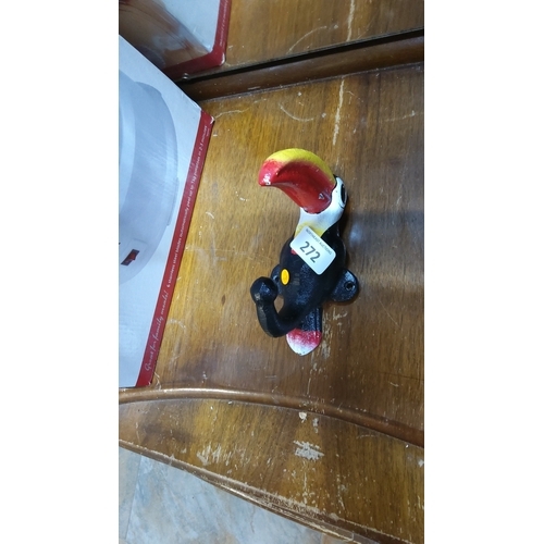 272 - Hand-painted cast iron toucan with red-and-yellow beak, designed as a coat hanger with twin mounting... 