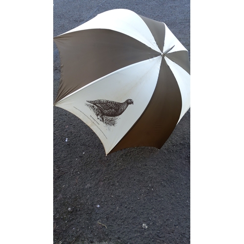 36 - Brown and cream alternating-panel umbrella with printed Famous Grouse motif, metal tip and turned wo... 