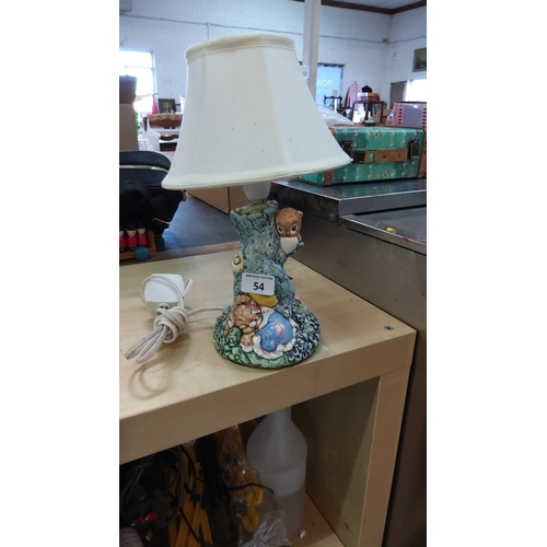 54 - One whimsical table lamp with cream fabric shade and moulded ceramic base modelled as a tree stump w... 