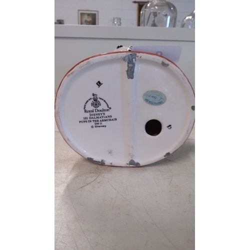 6 - A Royal Doulton Disney '101 Dalmatians' porcelain group, 'Pups in the Armchair' (DM11), modelled as ... 