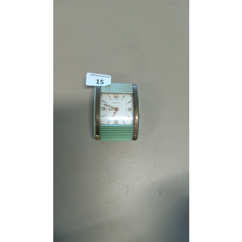 15 - A vintage Westclox clock, with white square dial, Arabic numerals and baton markers, in ribbed turqu... 