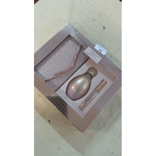 12 - Set of 3 ‘Lovely’ fragrance items, comprising a glitter-finish cosmetic pouch, a perfume bottle, and... 
