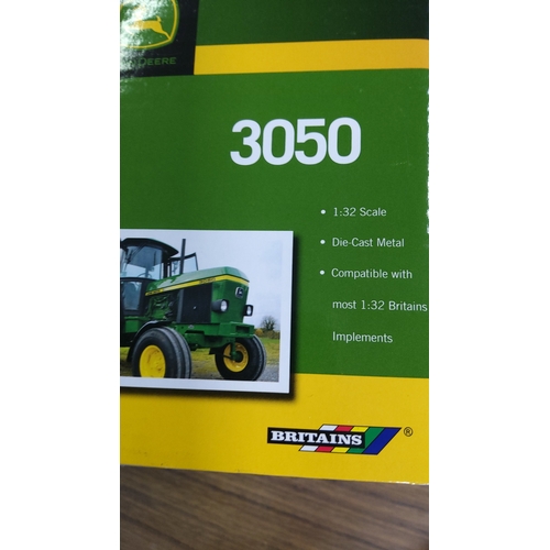 30 - A boxed John Deere 3050 tractor model by Britains, 1:32 scale die-cast metal, in green and yellow li... 