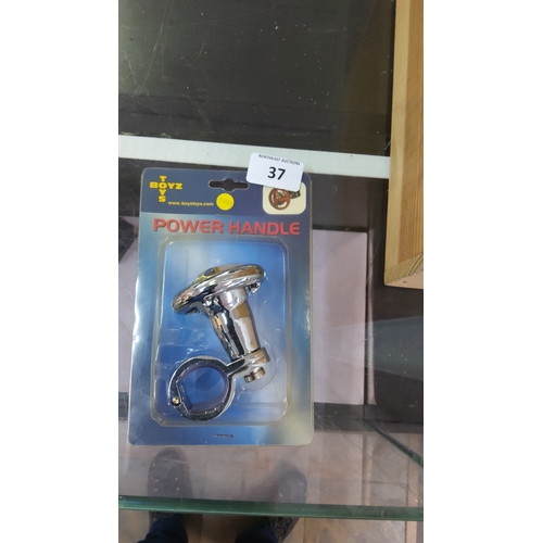 37 - A boxed T Boyz Toys chrome-effect power handle, with clamp fitting, presented in original blister pa... 