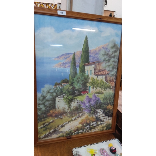 49 - A framed coastal landscape painting, depicting a Mediterranean villa and garden with cypress trees o... 