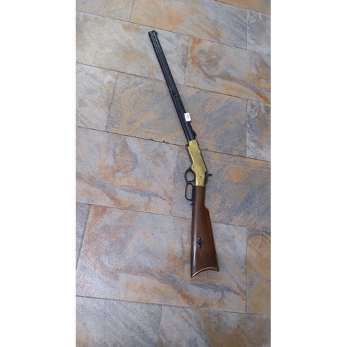 Replica plastic and rubber rifle with octagonal barrel, brass-coloured ...
