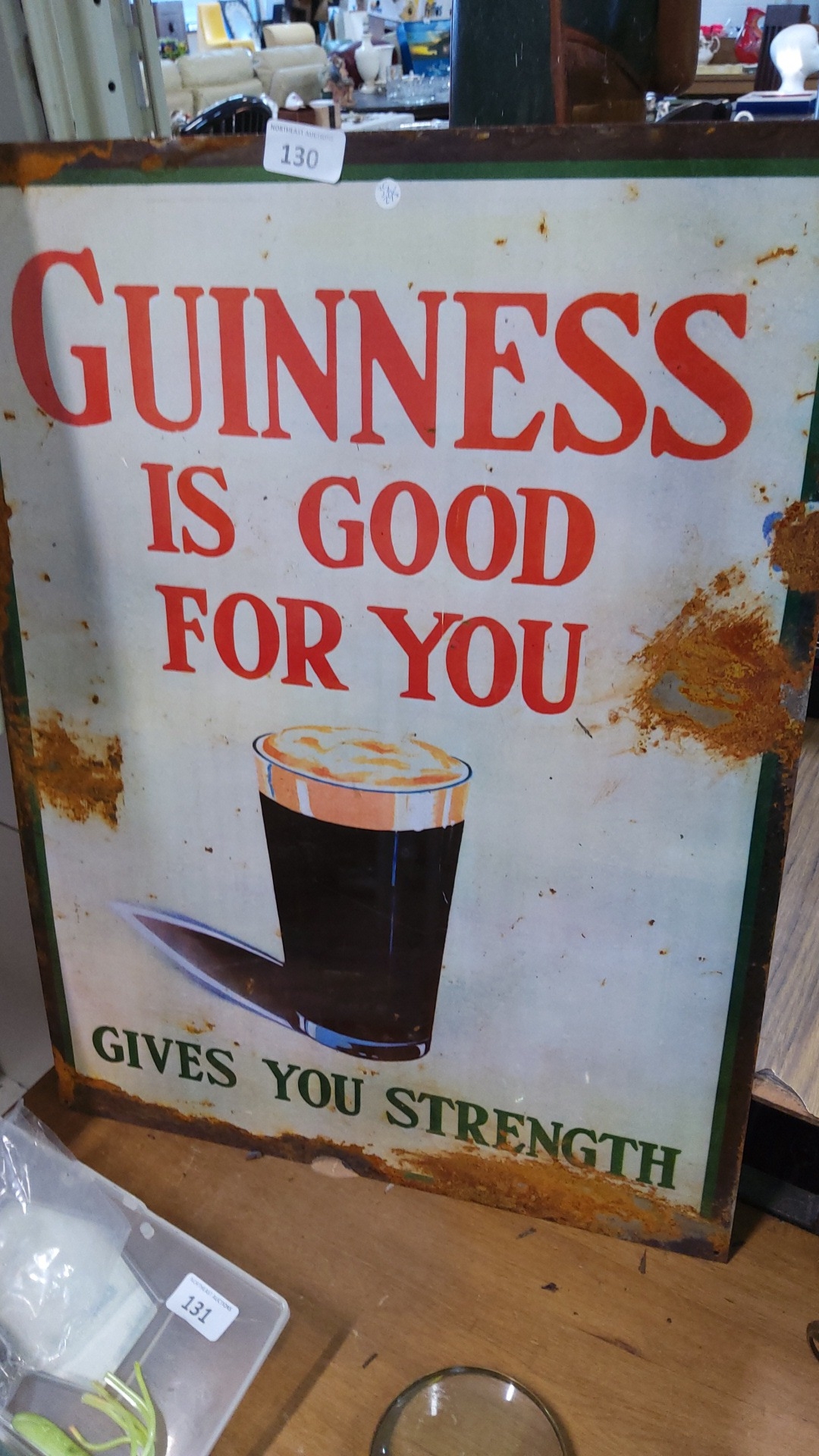 Guinness advertising tin sign, printed in red and green with the slogan ...