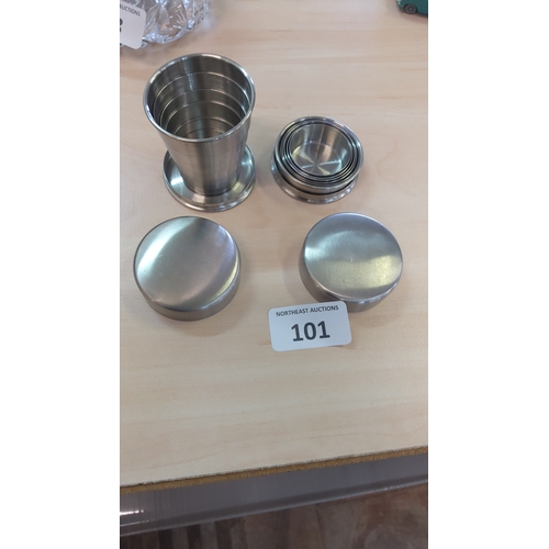 101 - Stainless steel collapsible travel beakers with nested measuring cups, presented with two screw-top ... 