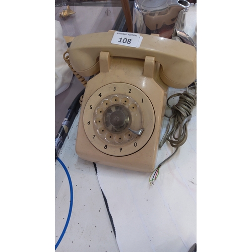 108 - Mid-20th century cream Bakelite rotary dial telephone, the circular dial with clear plastic finger w... 