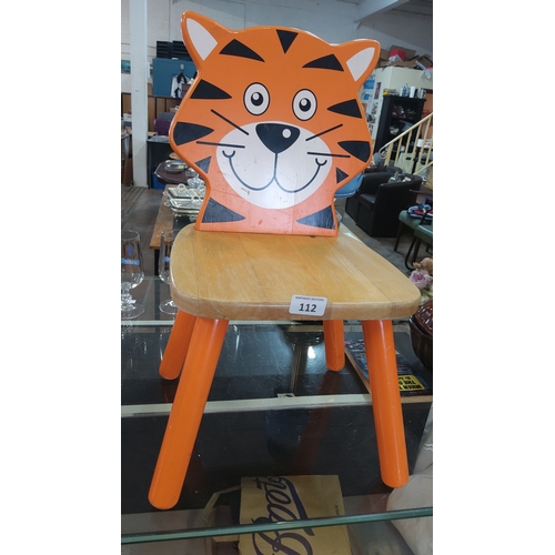 112 - Children’s painted wooden chair with tiger-form back splat, natural wood seat, and splayed cylindric... 