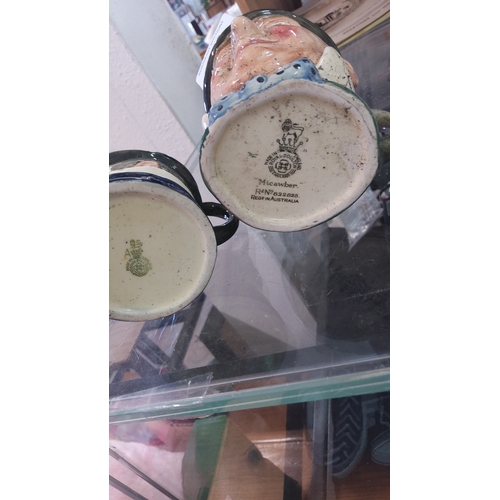 114 - Royal Doulton character toby jugs, England—titled ‘Micawber’, modelled as a gentleman in green top h... 