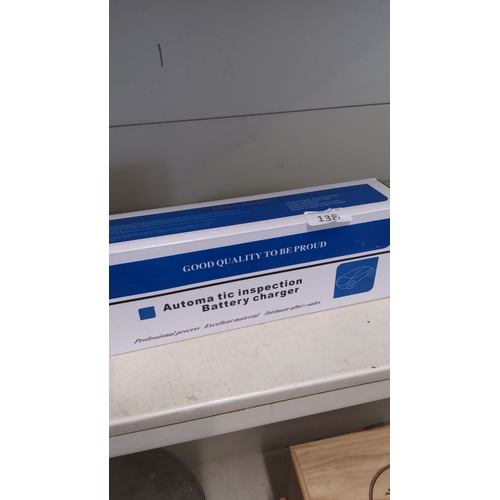 138 - Automatic inspection battery charger, boxed, printed with specifications including input voltage AC ... 