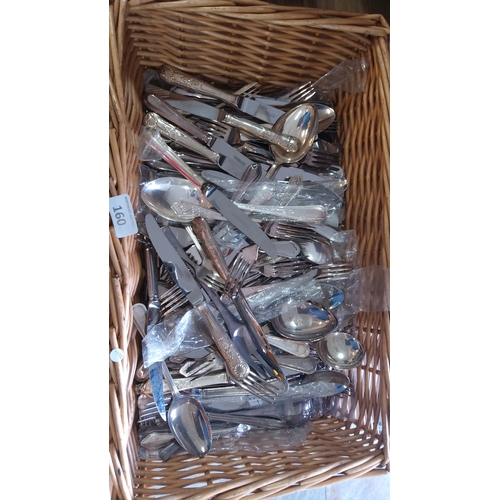 160 - An assortment of silver-plated flatware including table knives, forks, and serving spoons, in mixed ... 