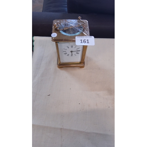 161 - Brass four-glass mantel carriage clock with Roman enamel dial and blued steel hands, the glazed top ... 