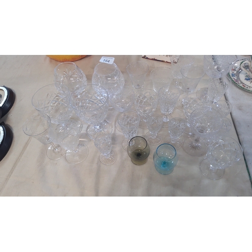 164 - A group of cut-glass & crystal drinking wares, comprising assorted stemmed goblets, tumblers, and sm... 